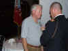 112 LTC Borg presents team salute certicicate & pin to Korean Veteran Daniel Lazenberry.JPG (95663 bytes)