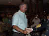 115 Wallace Bates receives team salute packet.JPG (97704 bytes)