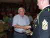 116 Richard Flowers receives team salute packet.JPG (83125 bytes)