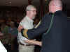 117 Neal Fouts receives team salute packet.JPG (110679 bytes)