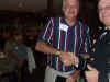 120 Bruce Latour receives team salute packet.JPG (95849 bytes)