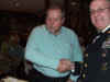 121 Mike Mason receives team salute packet.JPG (98121 bytes)
