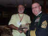 125 James Sanders receives team salute packet.JPG (110259 bytes)