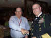 128 Mike Turner receives team salute packet.JPG (117318 bytes)