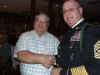 129 Terry Wallace receives team salute packet.JPG (122204 bytes)