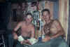L- Unknown R-Hood Reading mail and eating popcorn.jpg (127229 bytes)