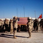 CPT Walker reenlisting SSG Bryant at Camp Wyatt.