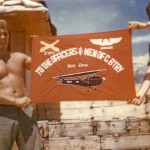 Herbert Skeens & SGM Andrew MaChristie holding banner from hawkeye section