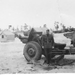 SGT Charles L. Stoddard poses with one of the Regiment's 155mm Howitzers
