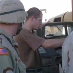 main2rev.jpg (21241 bytes) SPC Wilkerson assists PFC Therrien fix his vehicle lights